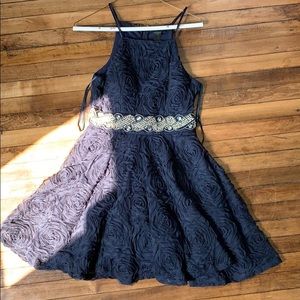 navy blue dress with jewels in middle
